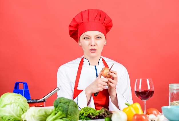 Suffer but keep doing Stinging eyes and tears cutting onions Chef cook peeling onion Kitchen routine Girl cooking healthy meal Housewife cook crying while cutting onion Slice and chop onion