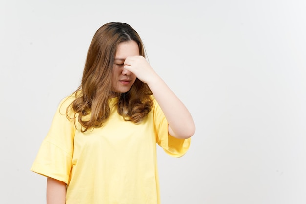 Suffering Headache of Beautiful Asian Woman wearing yellow TShirt Isolated On White Background