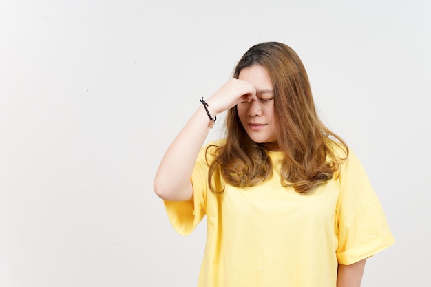 Suffering Headache of Beautiful Asian Woman wearing yellow TShirt Isolated On White Background