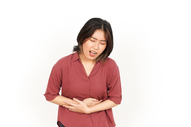 Photo suffering stomachache of beautiful asian woman isolated on white background