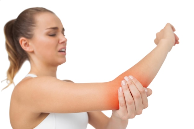 Photo suffering young woman touching her sore elbow on white background