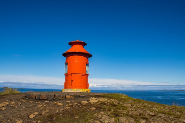 Sugandisey Cliffs, Iceland at Snaefellsnes Atlantic Ocean Sailing and Lighthouse of Island Landscape