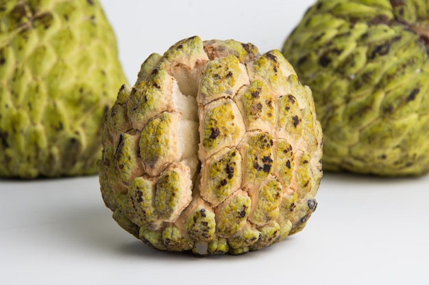 Sugar apple ( srikaya ) with black spots, isolated on a white background