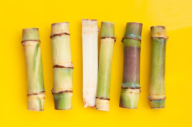 Sugar cane on yellow background