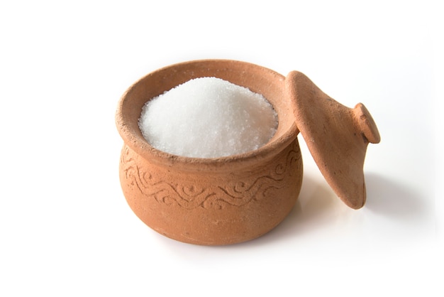 Sugar in clay pots isolated on white background