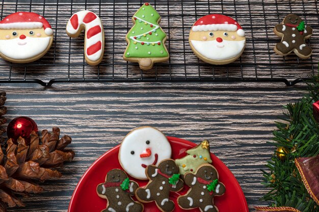 Sugar coated biscuits and Christmas theme cookies on a baking rack