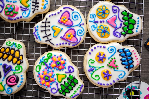 Sugar cookies in shape of sugar skull decorated with colorful royal icing for DÃÂ­a de Muertos-Day of the Dead holiday.