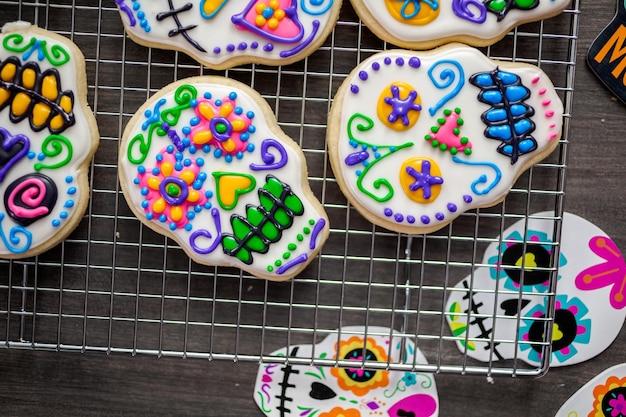 Sugar cookies in shape of sugar skull decorated with colorful royal icing for DÃÂ­a de Muertos-Day of the Dead holiday.