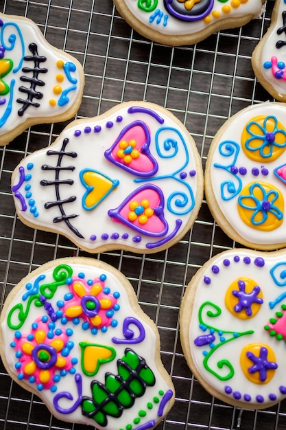 Sugar cookies in shape of sugar skull decorated with colorful royal icing for dãâ­a de muertos-day of the dead holiday