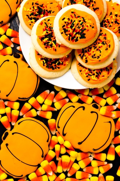 Sugar cookies with orange icing and spkinkles