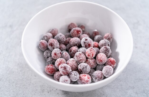 Sugar cranberries. Organic cranberries covered with white sugar.