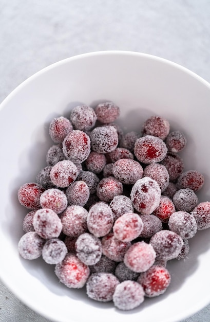 Sugar cranberries. Organic cranberries covered with white sugar.