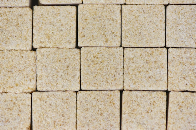 Sugar cubes background / Close up of brown sugar in box