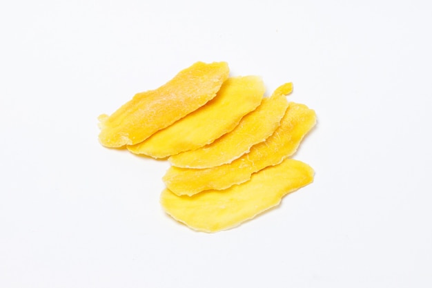 Sugar free slices of dried mango isolated on white background