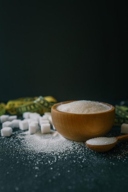 sugar and measuring tape health concept