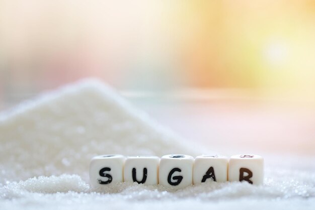 Photo sugar on nature blur background white sugar for food and sweets dessert candy heap of sweet sugar crystalline granulated