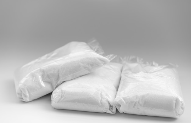 Sugar in packages on white background