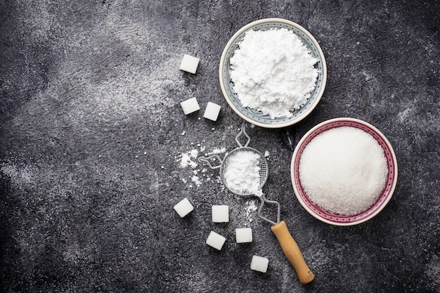 Sugar and powder on concrete background