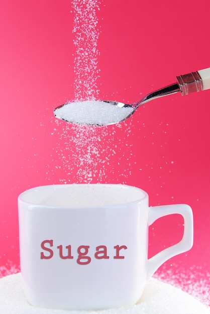 Photo sugar on red background