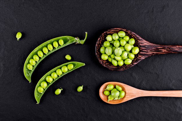 Sugar snap peas with mint on a rustic wood background