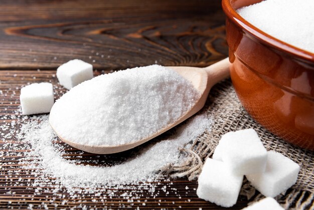 Sugar on wooden background