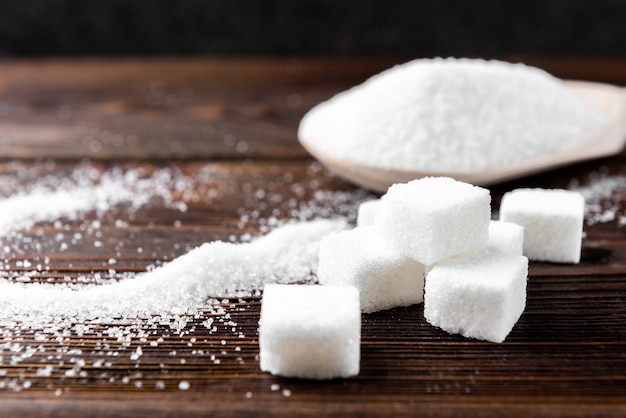 Sugar on wooden background