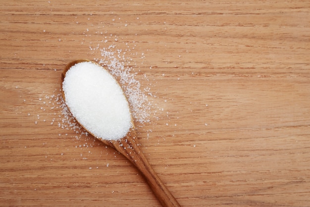 sugar on wooden spoon 