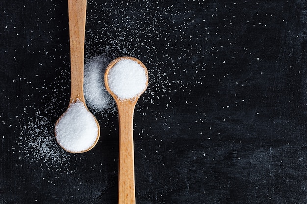 Sugar in wooden spoons 