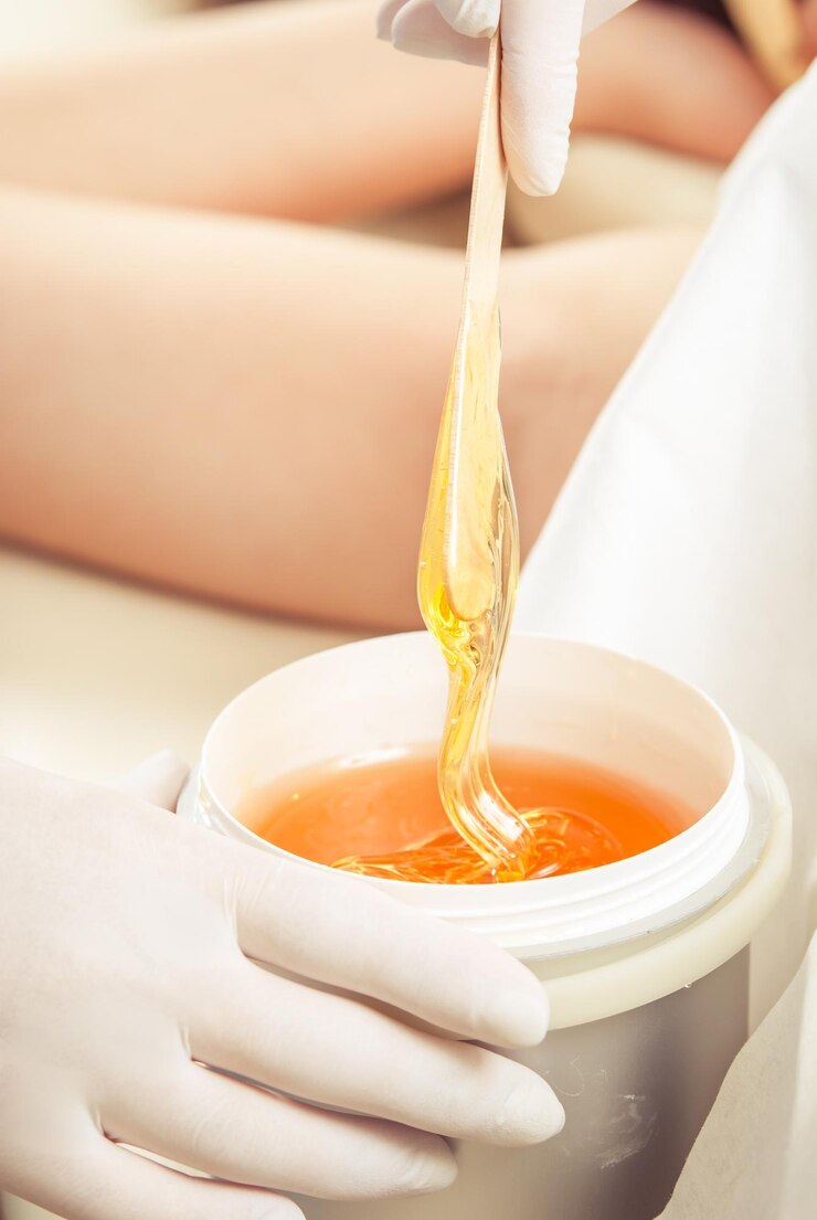sugaring armpit wax in a professional cosmetologist