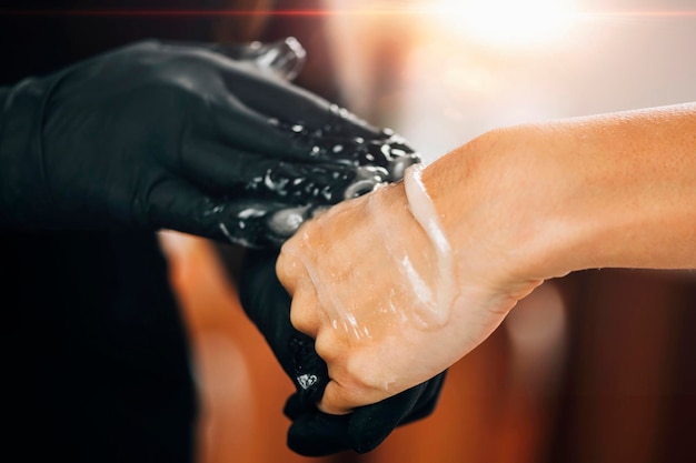 Sugaring Depilation Beautician Applying Sugar Paste on a Female Hand