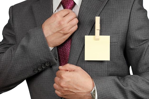 Suit businessman with clothespin and sticker instead of badge ecology concept