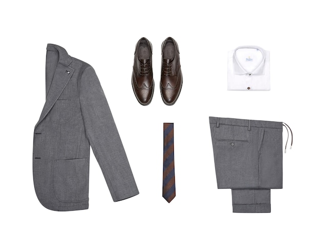 A suit, shirt, tie, and shoes are laid out on a white background.