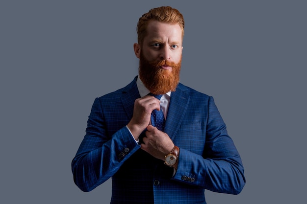 Suit and tie of bearded business boss business boss in suit isolated on grey background