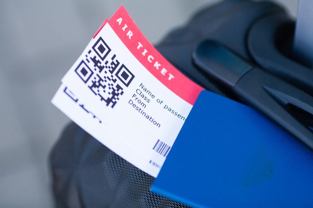 Suitcase and boarding pass at the airport