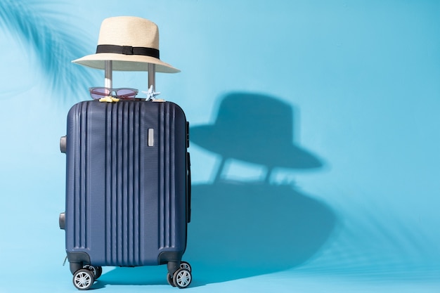 A suitcase is placed on a blue background