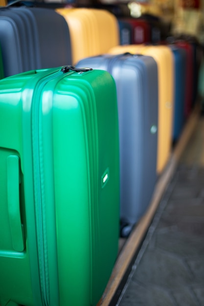 Suitcases or Travel Bag in a row on the floor in Hypermarket. Shopping concept.