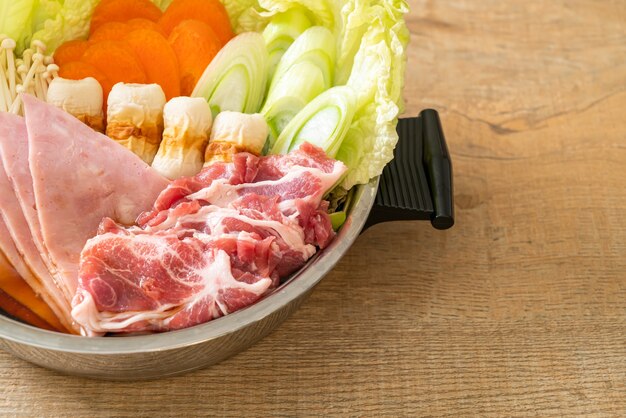 sukiyaki or shabu hot pot black soup with meat raw and vegetable - Japanese food style