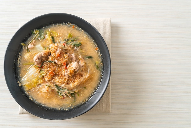 Sukiyaki Soup with Pork in Thai Style or  boiled vermicelli with pork and vegetables in sukiyaki soup - Asian food style