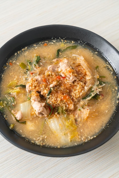 Sukiyaki Soup with Pork in Thai Style or  boiled vermicelli with pork and vegetables in sukiyaki soup  Asian food style