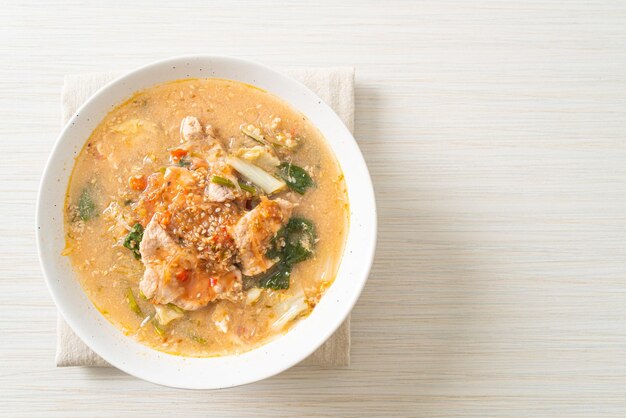 Sukiyaki soup with pork in thai style or boiled vermicelli with pork and vegetables in sukiyaki soup asian food style