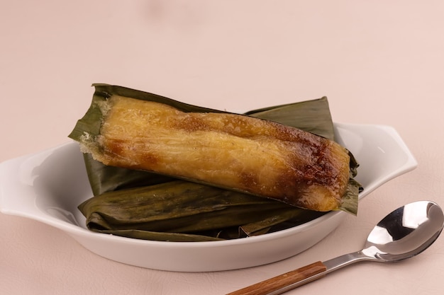 Photo suman cassava is a filipino dessert made from grated cassava kakanin na kamoteng kahoy