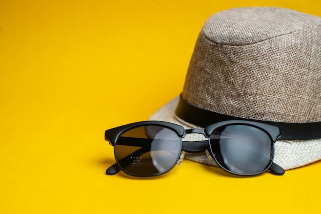 Summer accessories, hat and sun glasses. Summer vacation and sea concept.