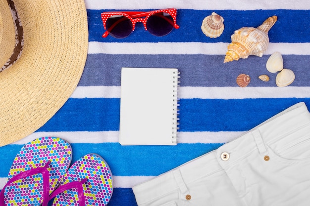 Summer accessories with notebook and copy space. 