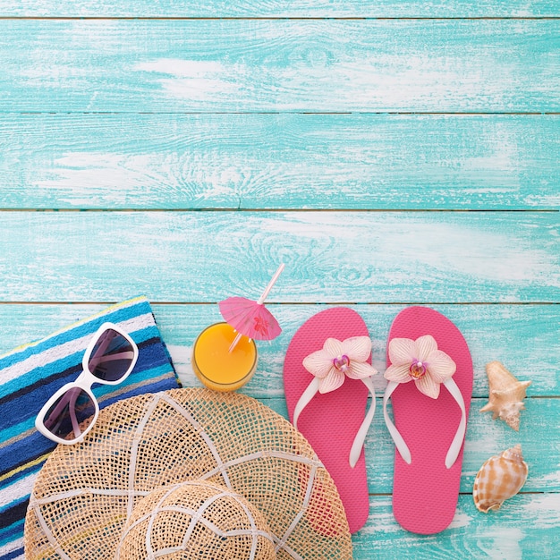 Summer accessories on wooden background