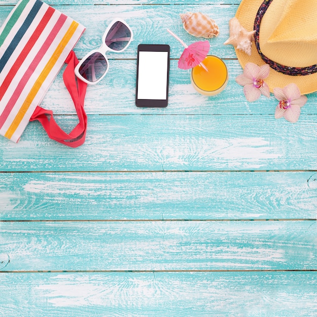 Summer accessories on wooden background