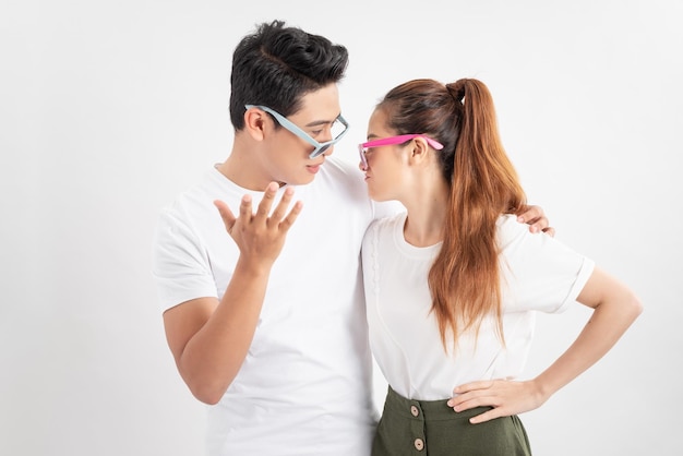 Summer accessory eyewear and people concept portrait of happy couple in white tshirts and sunglasses