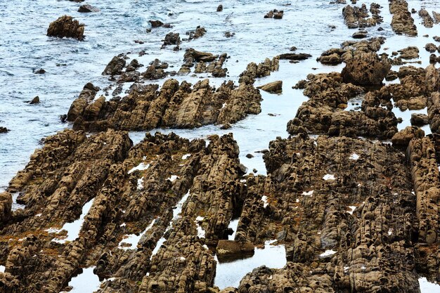 Summer Atlantic ocean Biscay bay coast with rock formations near shore