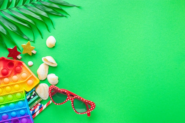 Summer background mood, tropical leaf, sun glasses, seashells, fun accessories