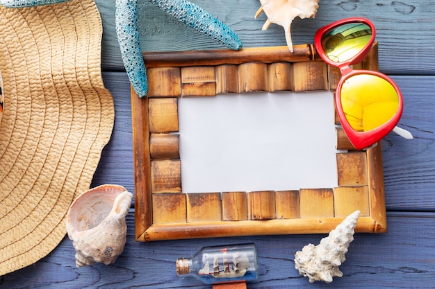 Photo summer background starfish, coral, photo frame, seashell, sunglasses,