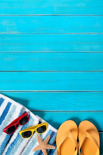 Summer beach background border, sunglasses, flip flops, starfish